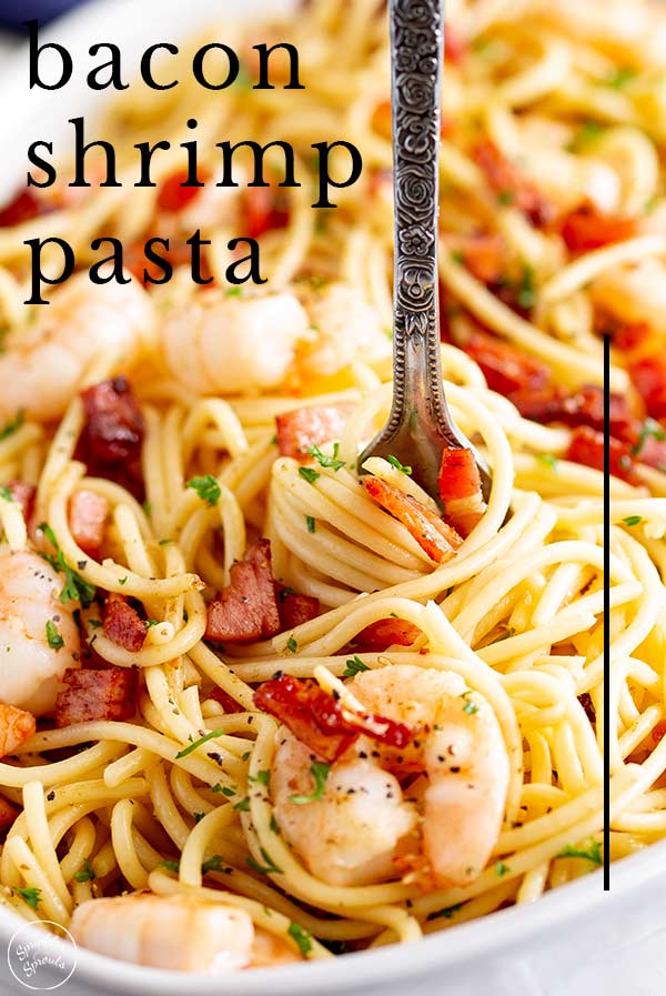 a fork swirling shrimp and bacon pasta wth text at the top