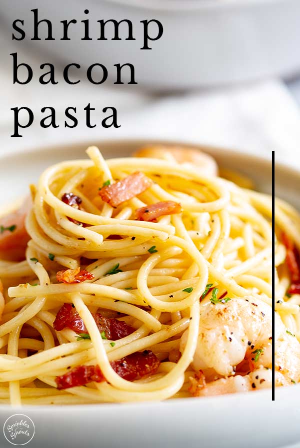 pasta swirled on a plate with bacon and shrimp and text at the top