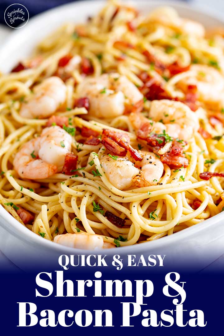 an oval dish of pasta with shrimp on top and text at the bottom