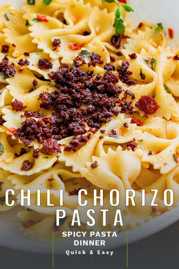 close up on the crispy chorizo on pasta with text at the bottom