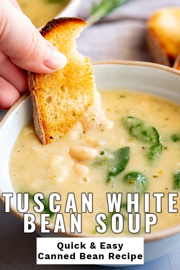 bread dipping into bean soup with text at the bottom
