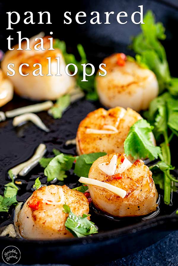 Thai scallop in a cast iron skillet with text at the top