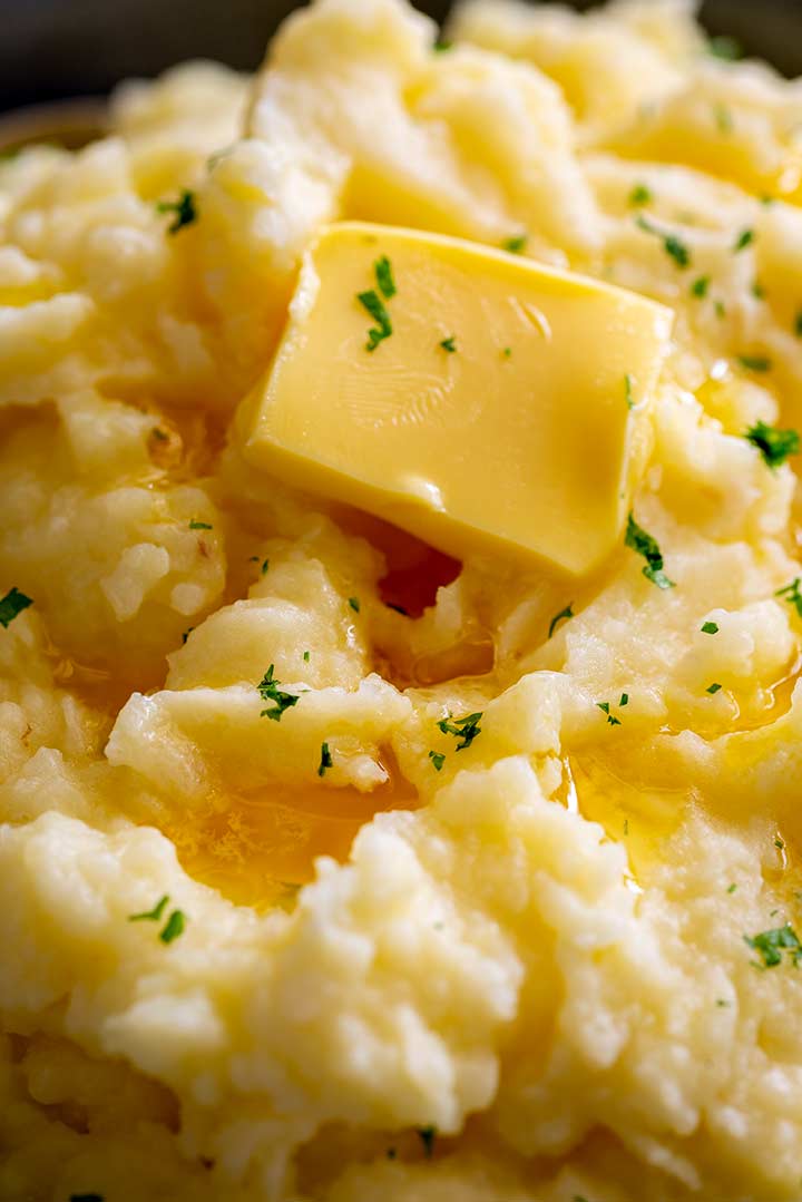 super close up of the butter melting into some British Mash