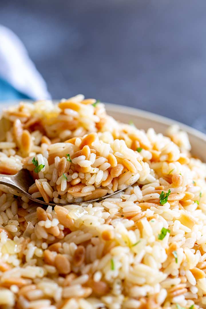 close up on a spoonful of rice and orzo