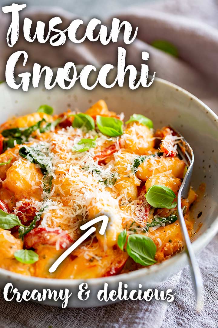 PIN IMAGE - a fork digging into a rustic bowl of gnocchi