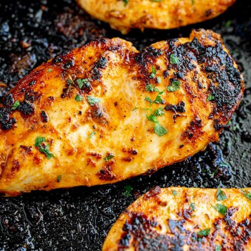 overhead view of a charred chicken breasts