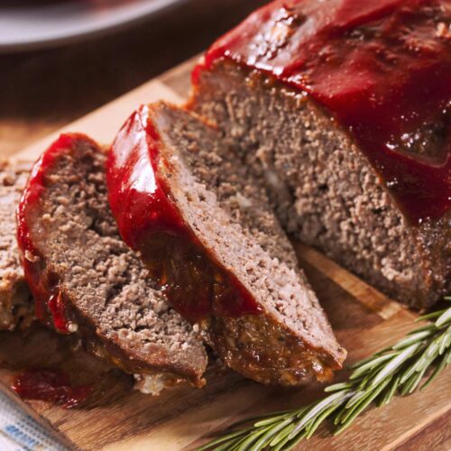 overhead of slices of meatloaf on a chopping board