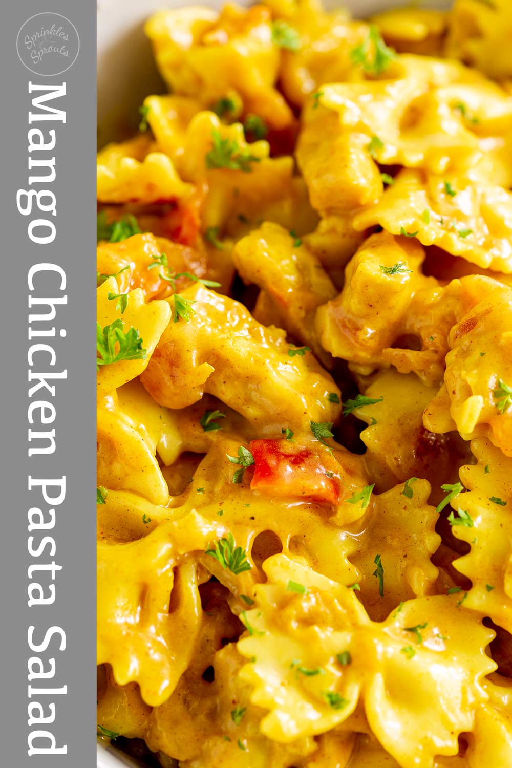 Pin image - Mango chicken pasta salad with text overlay