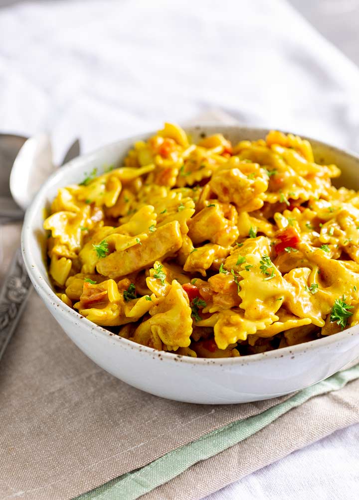 chicken pasta salad made with farfalle pasta and mango dressing