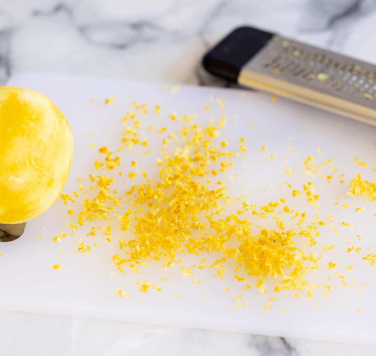 lemon zest on a board made with a micro grater