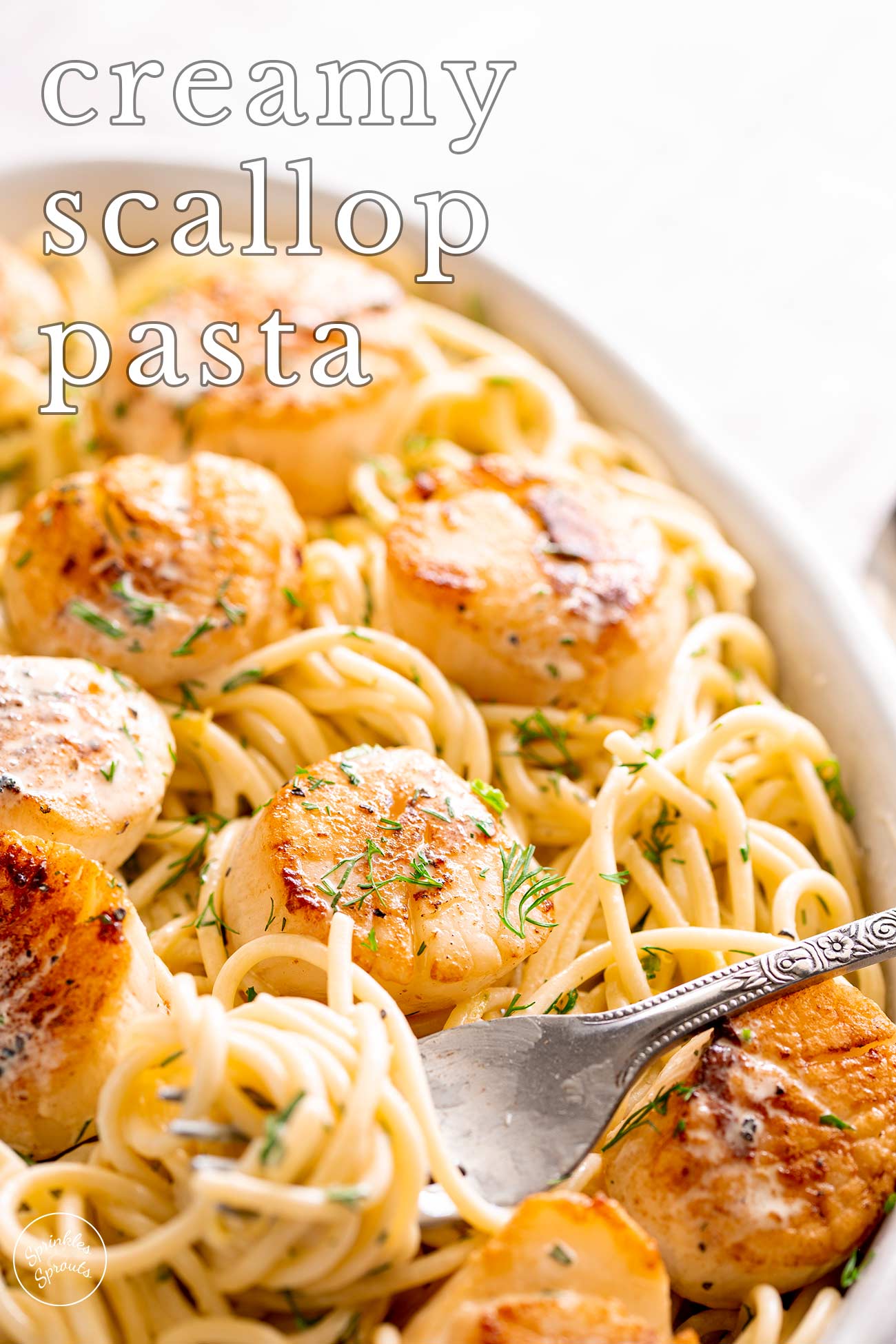 PINTEREST IMAGE - Creamy scallop pasta with text overlay