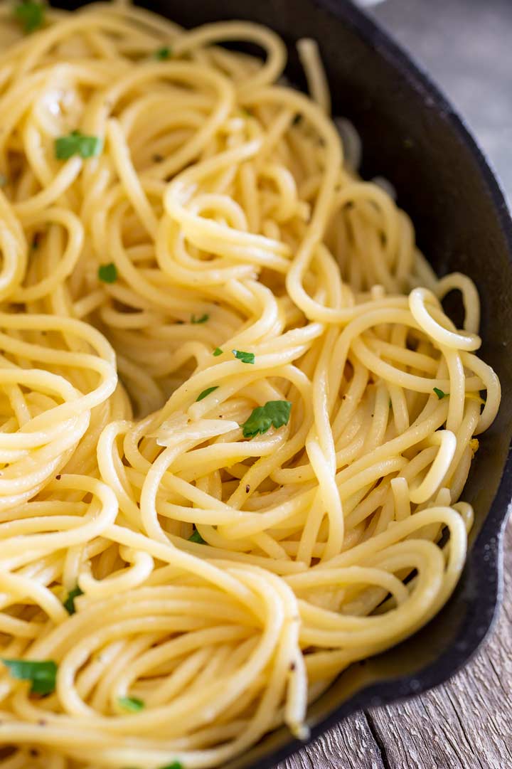 close up on the spaghetti in a black skillet