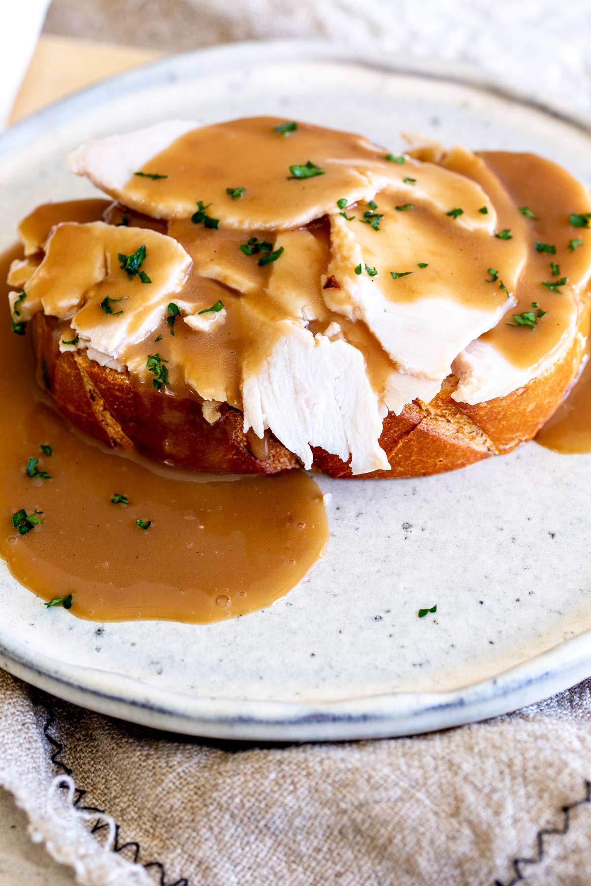 gravy poured over toast and sliced turkey
