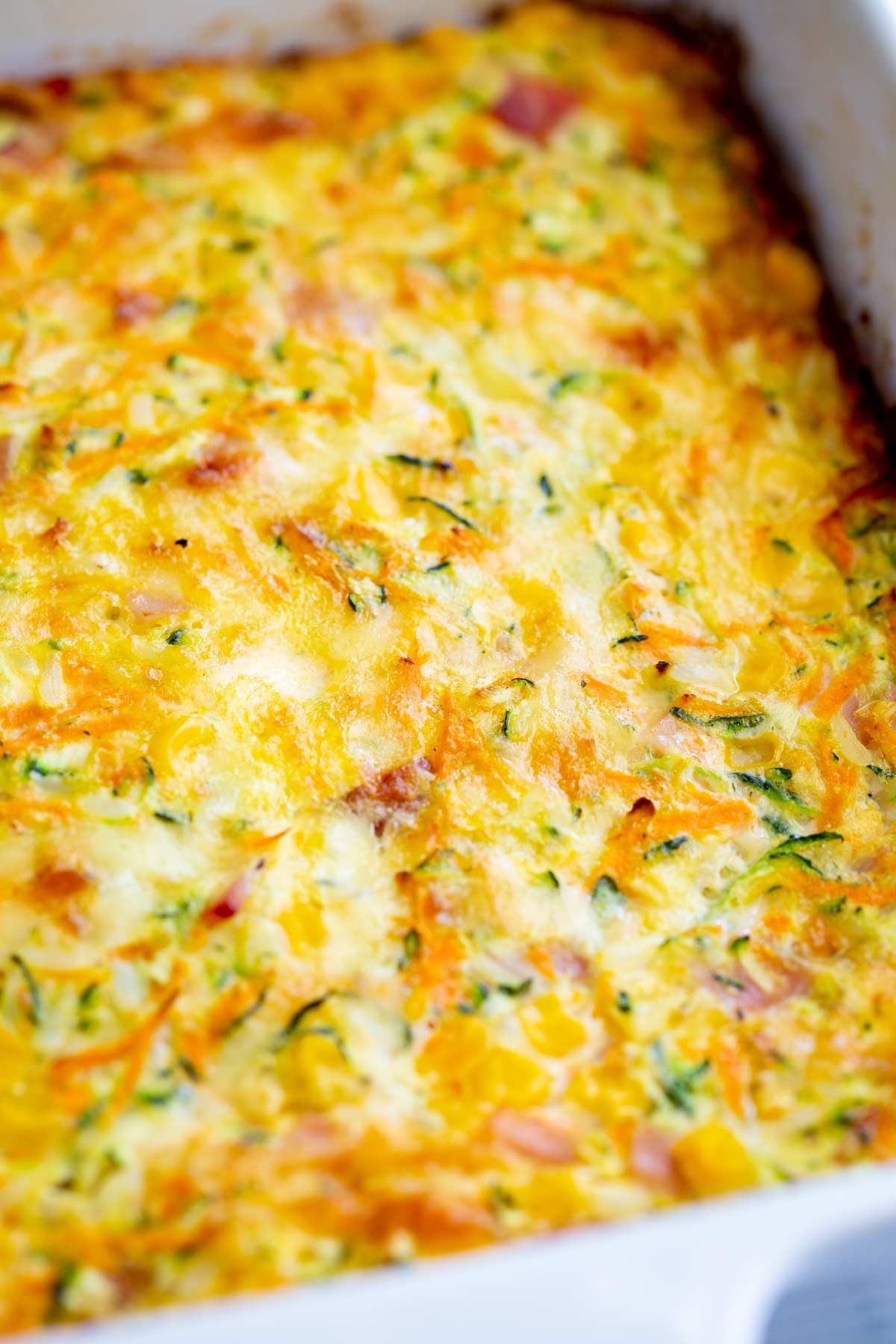 A square baking dish with cooked Frittata in it