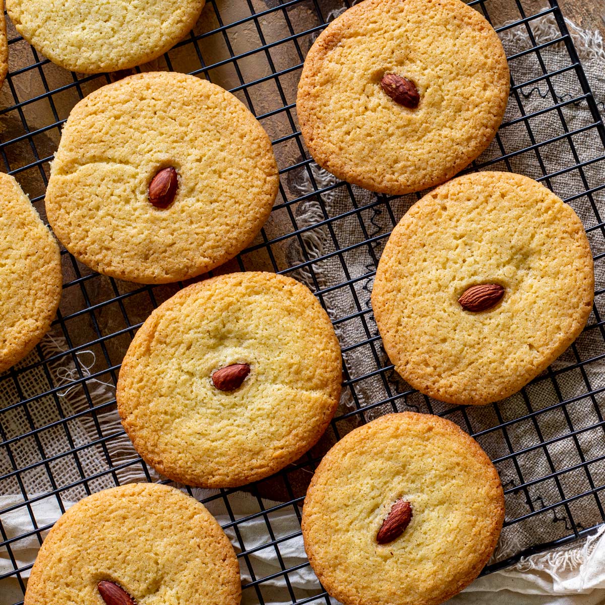 overhead close up of almond cookies on a rack