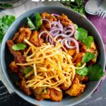Pinterest Image - Bowl of Chicken Salli with text overlay