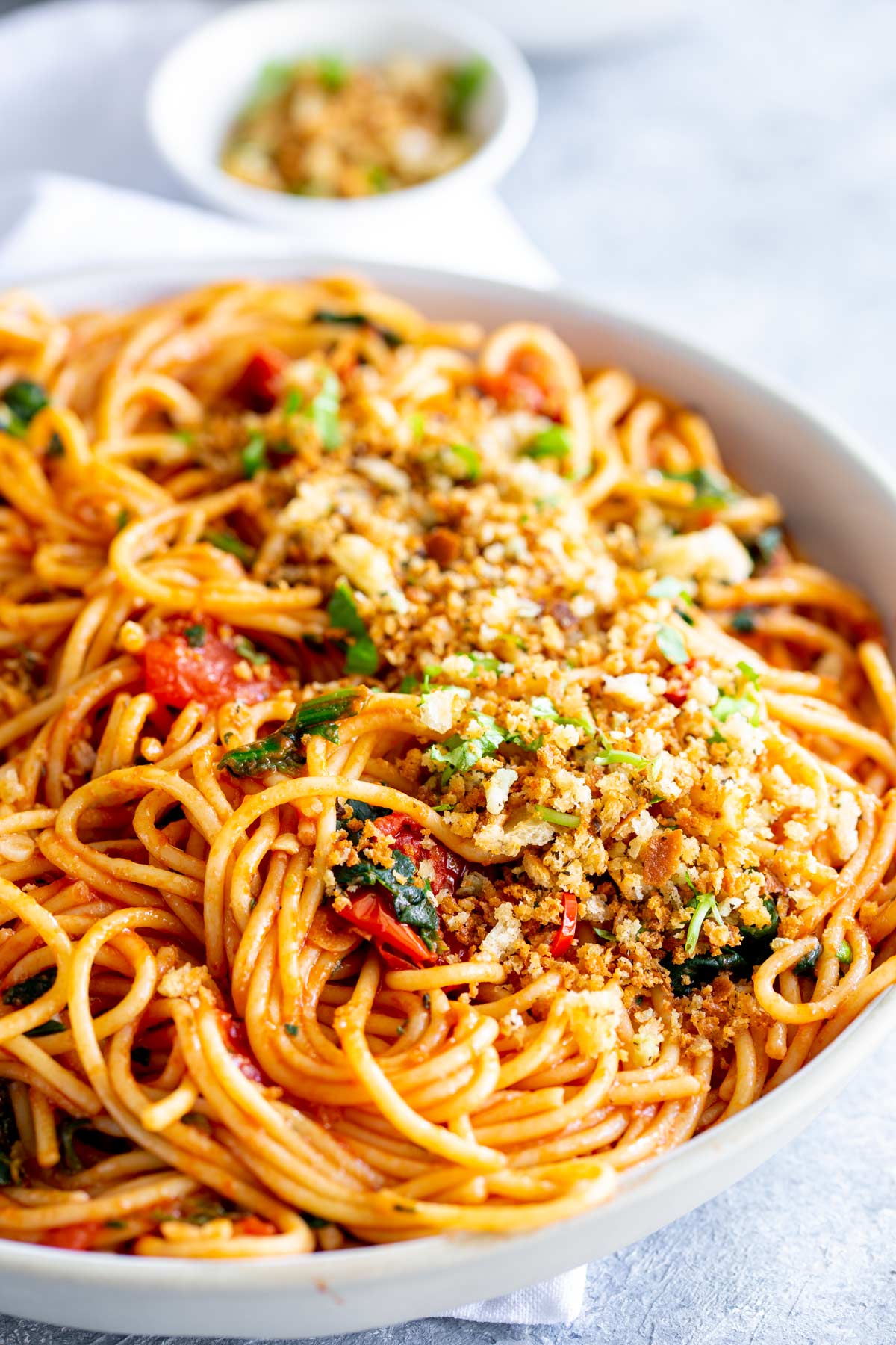Large bowl of tomato spaghetti with Pangrattato on top