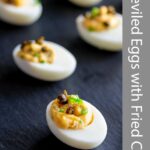 Pin Image: Deviled eggs with fried capers with text overlay