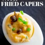 Pin Image: Deviled eggs with fried capers with text overlay