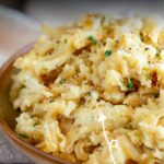 pin image: Caramelized Onion Mashed Potatoes with text overlaid