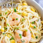 pinterest image: corn shrimp pasta with text overlaid