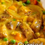 pinterest image: Curried Sausages with text overlaid