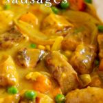 pinterest image: Curried Sausages with text overlaid