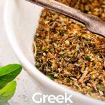 pin image: bowl of greek seasoning with text overlay