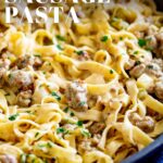 Pinterest image: Creamy Italian Sausage Pasta pasta with text overlaid
