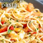 pinterest image: tomato shrimp pasta in a bowl with text overlaid