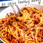Pin Image: Tongs in Bacon Tomato Pasta with text overlaid