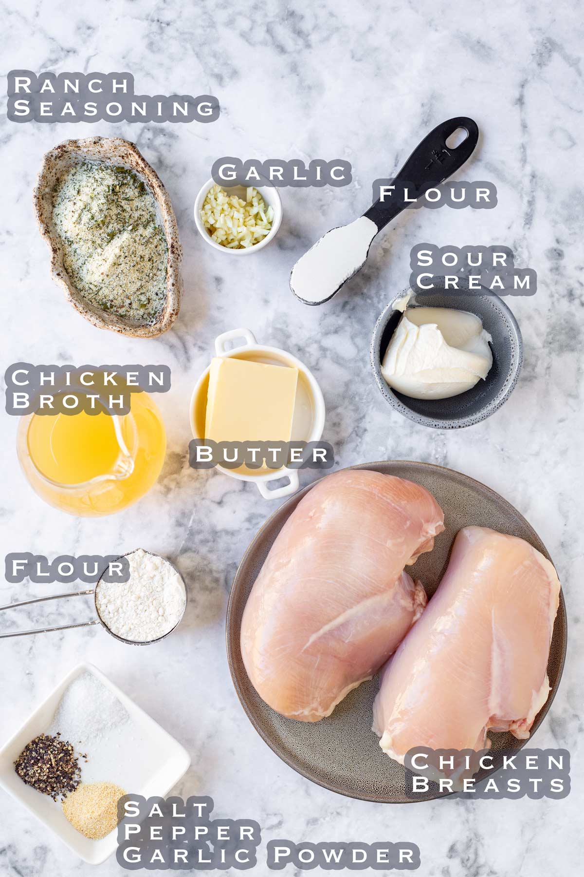 ingredients for making ranch chicken laid out on a marble bench