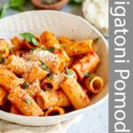 Pinterest image: Rigatoni Pomodoro in a bowl with text overlaid