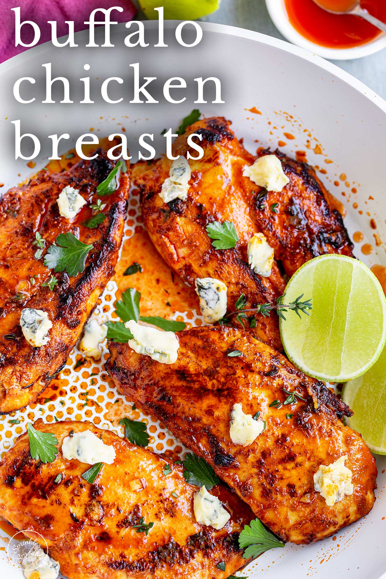 Pin Image: Buffalo Chicken Breasts topped with blue cheese crumbles with text overlays