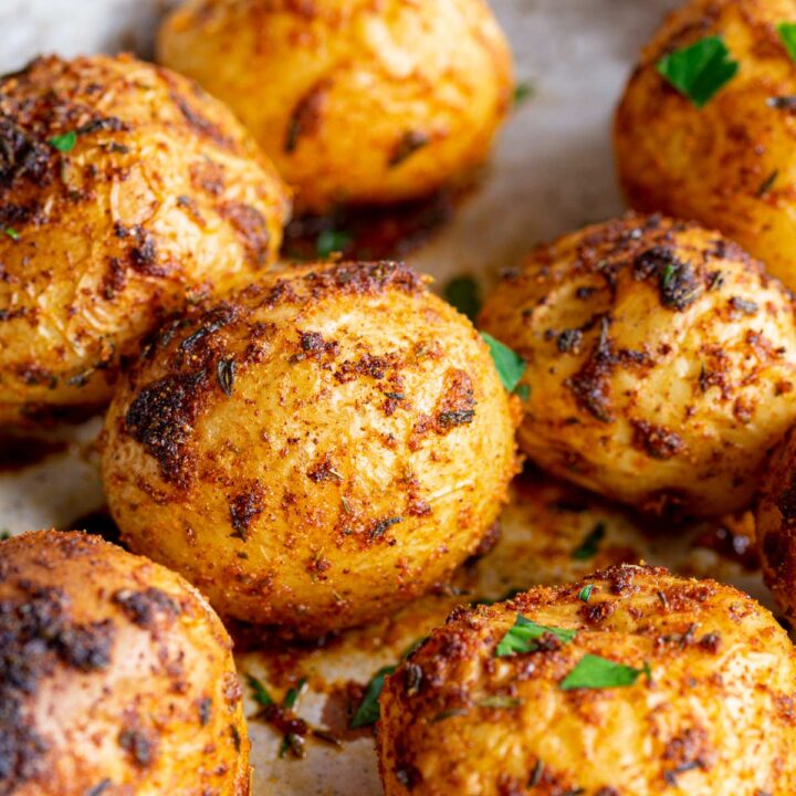 close up on a roasted baby potato with cajun spices