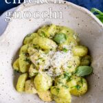pin image: Pesto Chicken Gnocchi in a rustic bowl with text overlaid