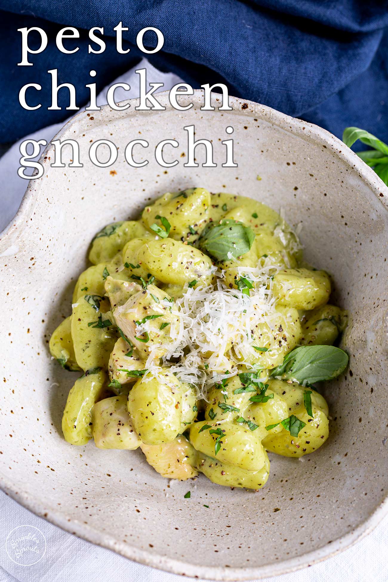 pin image: Pesto Chicken Gnocchi in a rustic bowl with text overlaid