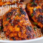 pin image: Harissa honey chicken in a frying pan with text overlaid