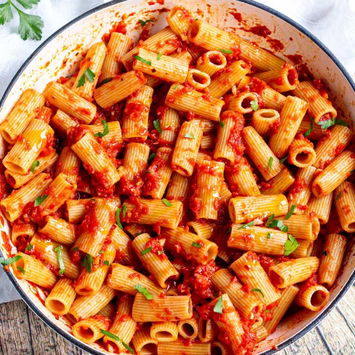 close upon the pasta coated with tomato sauce