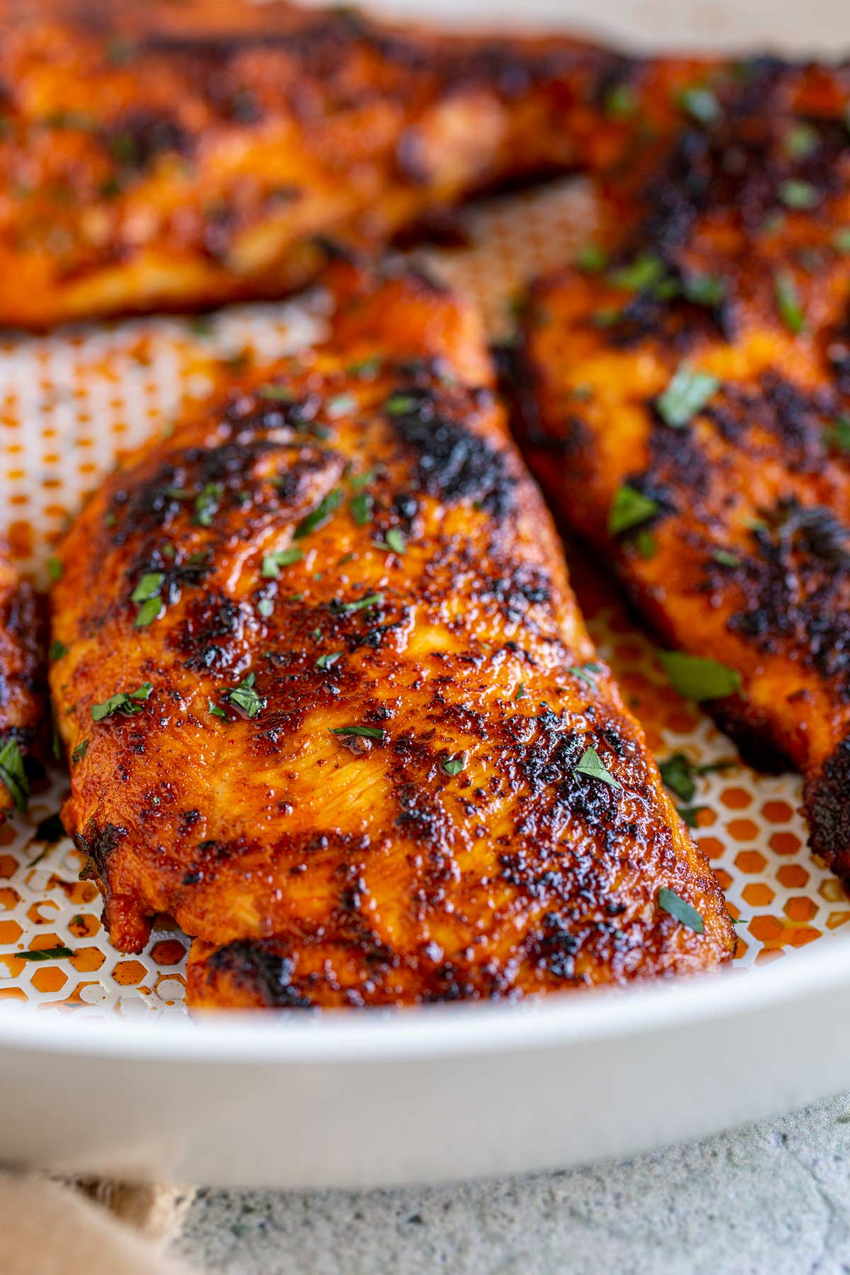 close up on the color of the cooked harissa honey chicken