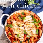 pin image: Rigatoni Arrabbiata with Chicken in a white skillet with text overlaid