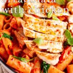 pin image: Rigatoni Arrabbiata with Chicken in a white skillet with text overlaid