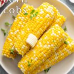 Pin Image: Corn on the cob cooked in the microwave with text overlaid