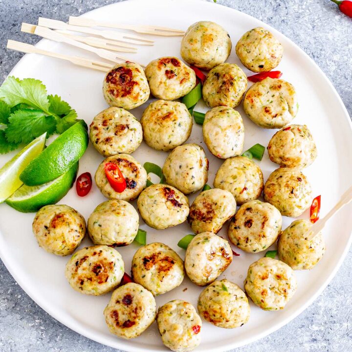 overhead shot of a plate of Thai spiced meatballs on a white plate