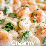 Pinterest image: Creamy shrimp gnocchi in a cast iron pan with text overlaid