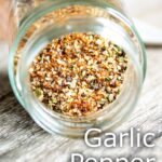 pin image: Close up on garlic pepper seasoning in a jar with text overlaid
