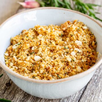 close up on Pangrattato in a rustic white bowl