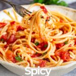 pin image: Spicy Shrimp Pasta in a rustic bowl with text overlaid