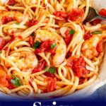 pin image: Spicy Shrimp Pasta in a rustic bowl with text overlaid