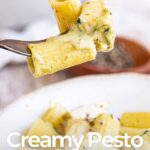 Pin Image: A fork picking up Creamy Chicken Pesto Pasta with text overlaid